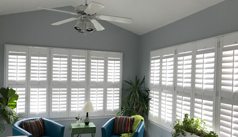 New Brunswick living room with fan and shutters